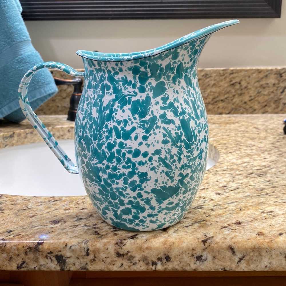 Cast iron speckled paint pitcher. White and turquoise